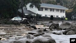 In this photo provided by Santa Barbara County Fire Department, mud and debris is shown due to heavy rain in Montecito. California, Jan. 9, 2018.
