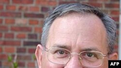 Botswana's Patrick Motsepe (front) challenges Anthony Annan of Ghana during their African Cup of Nations Group D soccer match in FranceVille Stadium.