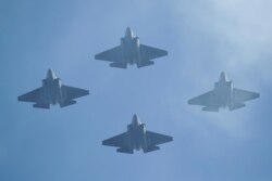 U.S. Navy F-35 jets fly over Levi's Stadium during the national anthem before an NFL playoff football game between the San Francisco 49ers and the Minnesota Vikings, Jan. 11, 2020, in Santa Clara, Calif.