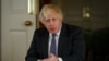 British Prime Minister Boris Johnson gestures as he records an address to the nation to provide an update on the booster vaccine COVID-19 program, at Downing Street, London, Britain, Dec. 12, 2021.