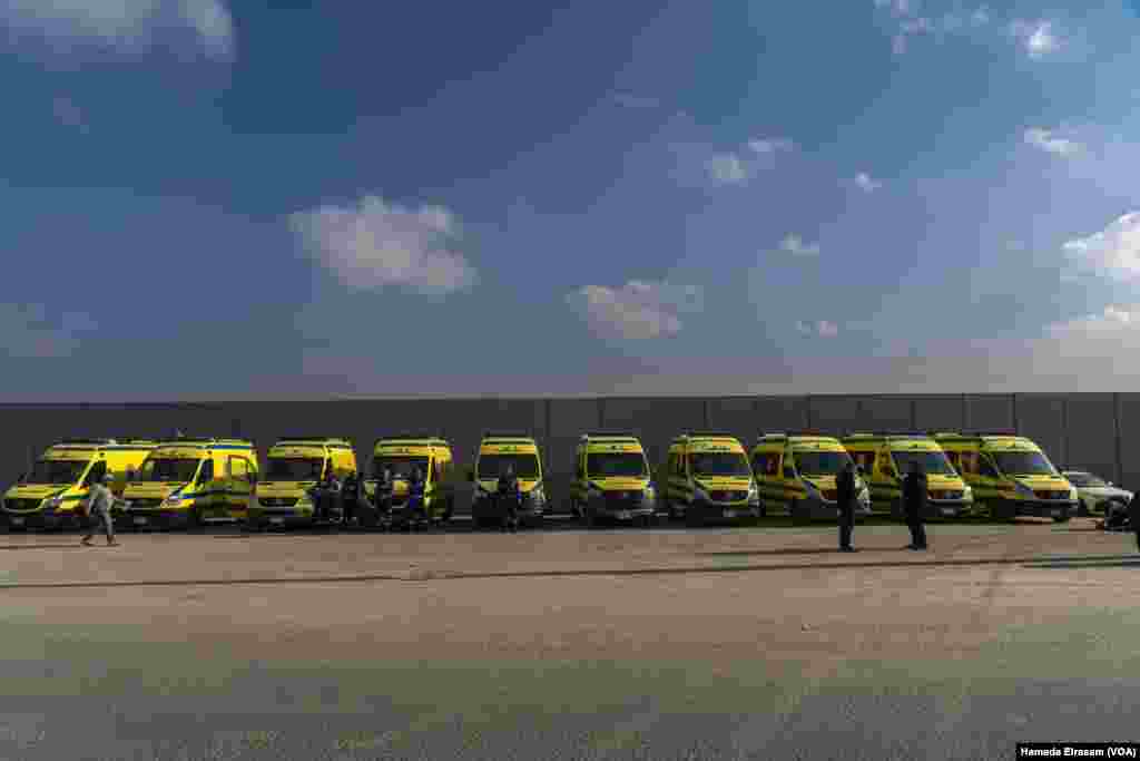 Empty ambulances wait along the Rafah border wall. The ceasefire deal stipulates the reopening of the crossing to 50 medical evacuees daily, since Gaza’s health sector is on "the brink of total collapse," the U.N. says. Rafah, Egypt, Feb. 4, 2025.