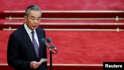FILE - Chinese Foreign Minister Wang Yi speaks at the Great Hall of the People in Beijing, China, Sept. 5, 2024. China, as well as Japan, is trying to improve relations ahead of U.S. President-elect Donald Trump’s return to the White House in the U.S.