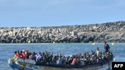 FILE - Migrants arrive on a boat at La Restinga dock, in the municipality of El Pinar on the Canary Island of El Hierro, on Oct. 21, 2023.