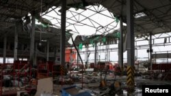 乌克兰哈尔科夫郊外的一家邮政配送中心2023年10月22日遭到俄罗斯导弹袭击。