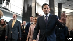 FILE - Secretary of State Marco Rubio and his wife Jeanette Rubio arrive to speak to employees upon arrival at the State Department in Washington, on Jan. 21, 2025.