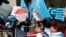 FILE - Uyghurs and their supporters rally across the street from United Nations headquarters in New York City, March 15, 2018. As Donald Trump’s second White House term nears, Uyghur American advocates push for tougher action on China’s Xinjiang policies.