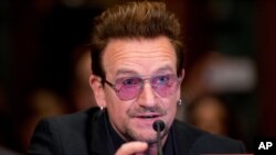 FILE - Irish rock star and activist Bono testifies on Capitol Hill in Washington before a Senate subcommittee hearing on the causes and consequences of violent extremism and the role of foreign assistance, April 12, 2016. 