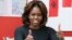 U.S. first lady Michelle Obama gestures during a language class for pre-school students at the Washington Yu Ying Public Charter School ahead of her upcoming trip to China, in Washington, March 4, 2014.