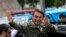 Jair Bolsonaro, presidential candidate with the Social Liberal Party, waves after voting in the presidential runoff election in Rio de Janeiro, Brazil, Sunday, Oct. 28, 2018. Bolsonaro is running against leftist candidate Fernando Haddad of the Workers’ P
