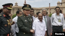 Activists shout slogans as they participate in a rally in Dhaka, Dec. 12, 2013. 