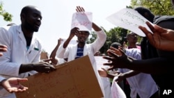 A group of Zimbabwean doctors sing as they protest at Parirenyatwa hospital in Harare, Zimbabwe, Sept. 15, 2019. 
