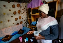 FILE - Idah Musimbi, 16, who contracted HIV at birth, takes PEPFAR-supplied antiretroviral pills in Nairobi, Kenya, on Aug. 16, 2023. Funds for PEPFAR, an acclaimed anti-HIV program, were apparently among those included in a U.S. aid freeze, Jan. 24, 2025.