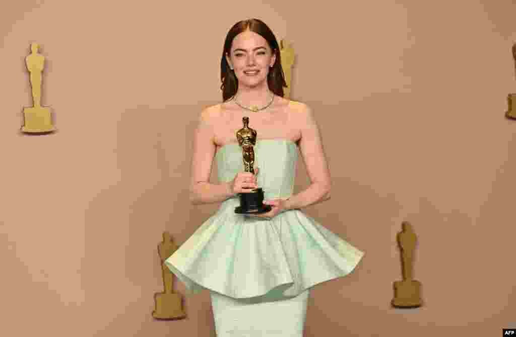 U.S. actress Emma Stone poses in the press room with the Oscar for Best Actress in a Leading Role for &quot;Poor Things&quot; during the 96th Annual Academy Awards at the Dolby Theatre in Hollywood, California, on March 10, 2024.
