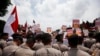 Supporters of national police chief nominee Budi Gunawan rally outside the presidential palace in support of his confirmation, in Jakarta, Indonesia, Feb. 16, 2015.